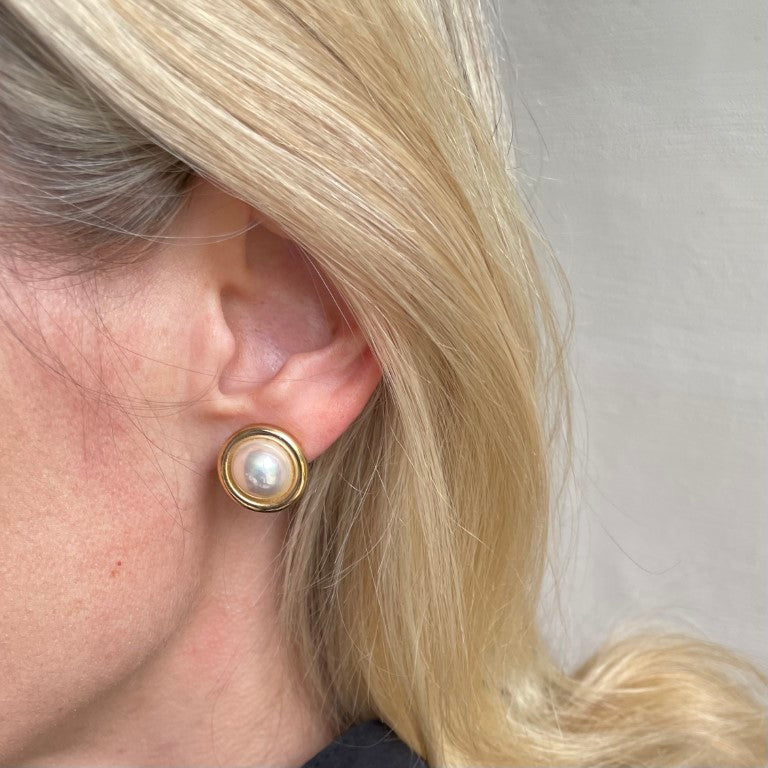 A pair of Vintage Christian Dior Faux Pearl Clip On Round Earrings