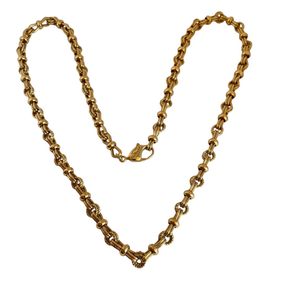 Vintage 1980s Christian Dior matinee length chain necklace in 18ct yellow gold plating, featuring an alternating pattern of stylized figure-of-eight links and textured rope-twist segments, displayed on white background