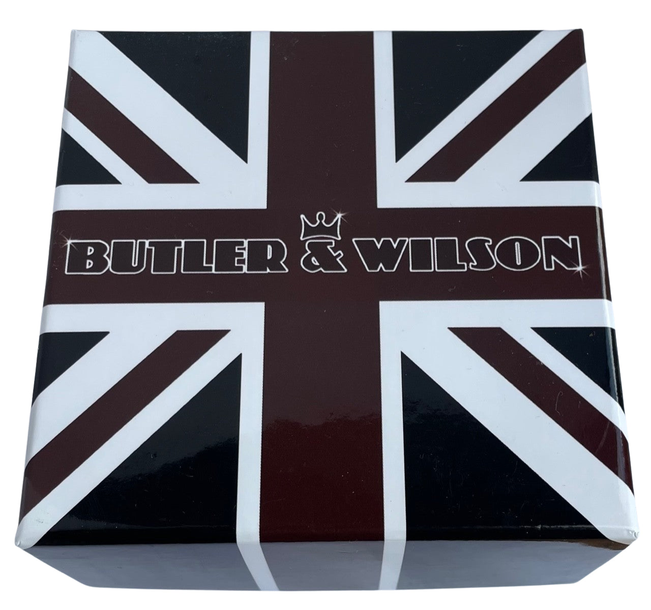 A square product box featuring a glossy Union Jack design in dark brown, black, and white, with the brand name 'BUTLER & WILSON' printed across the center.