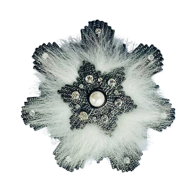 Immaculate vintage Givenchy snowflake brooch from the 1980s. Features a dark japanned metal snowflake outline clear crystals, central faux pearl, and soft white 'fur'.