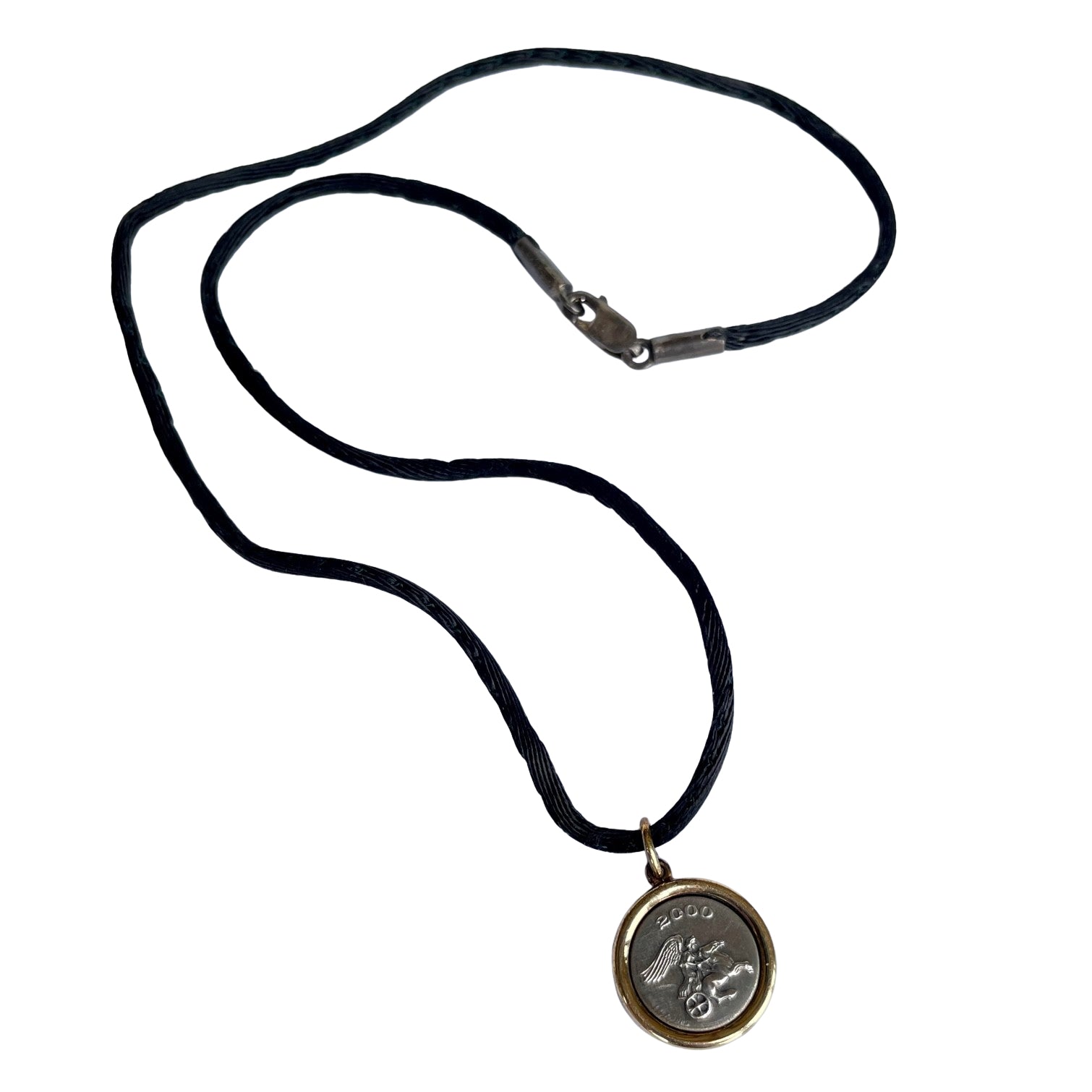Pristine vintage Ilias Lalaounis necklace showing a 1.6cm 925 sterling silver detailed pendant with an 18K yellow gold border bezel on a 42cm black fabric cord.