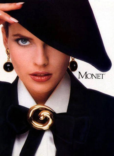 Monet advert from 1986 featuring Carol Alt wearing Monet brooch