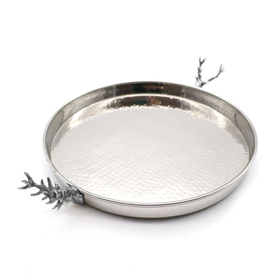 A Culinary Concepts round silver metal tray with a hammered texture and decorative stag handles on both sides, shown on a plain white background.