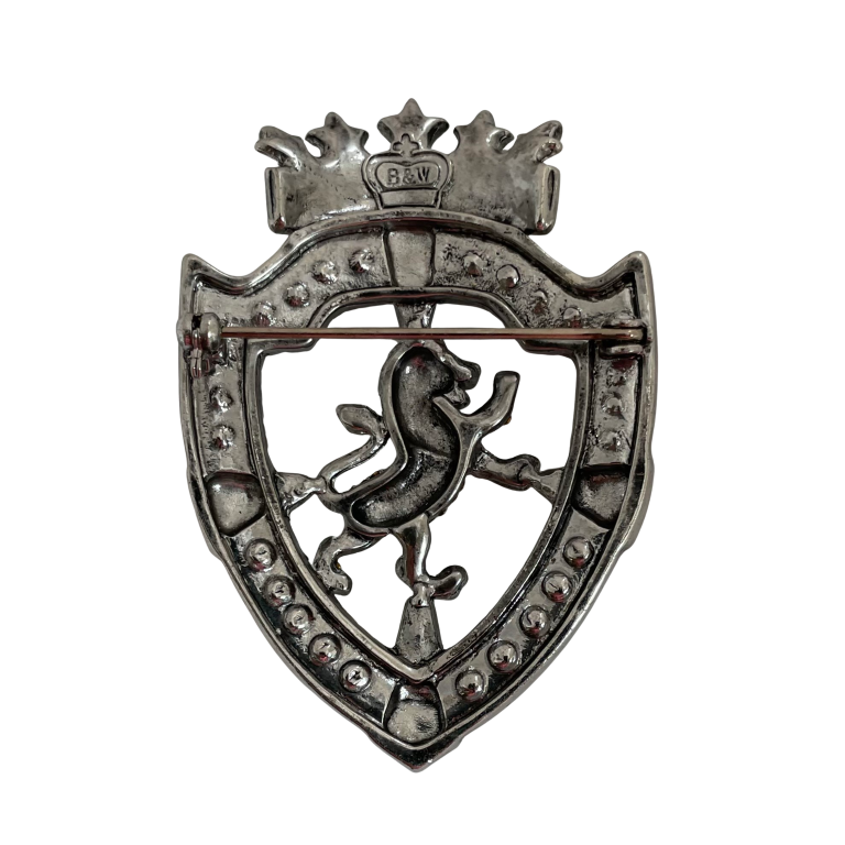Butler & Wilson Platinum Jubilee brooch featuring E.R. cypher, aurora borealis crystals, ropework border, and rampant lion motif in silver-tone metal.