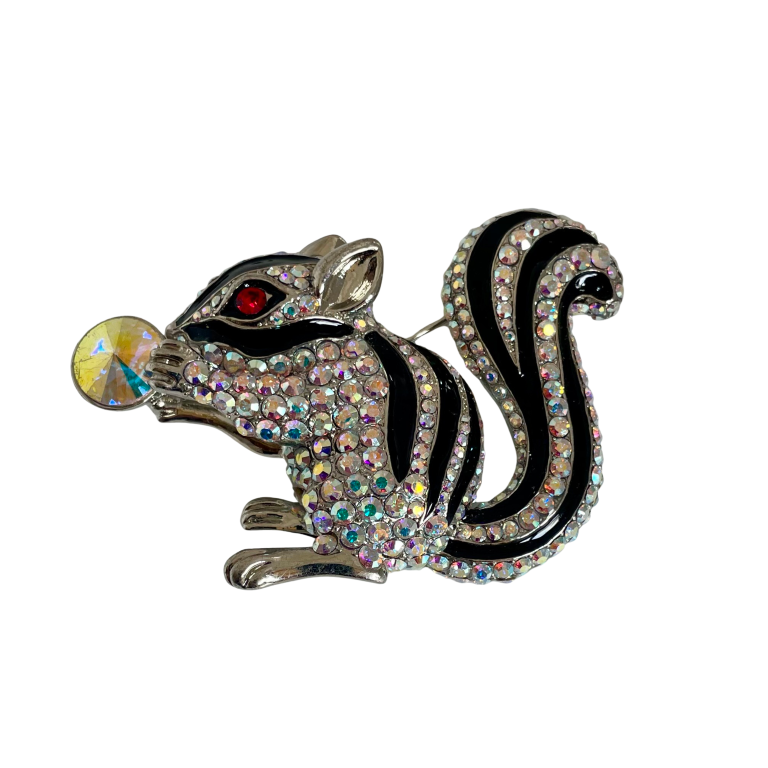 Butler & Wilson squirrel brooch featuring silver-tone metal, aurora borealis crystals, black enamel details, red eye, and crystal nut, presented in box.