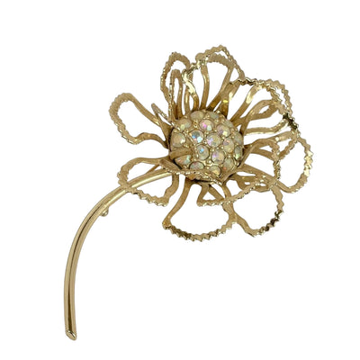Vintage 1968 Sarah Coventry Allusion flower brooch with a long gold-plated stem and aurora borealis crystal centre