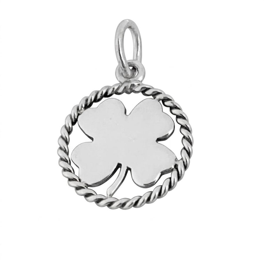 A polished silver four-leaf clover charm by Tiffany and Co. The clover leaf is enclosed in a circular twisted wire rope border and features a silver jump ring at the top.