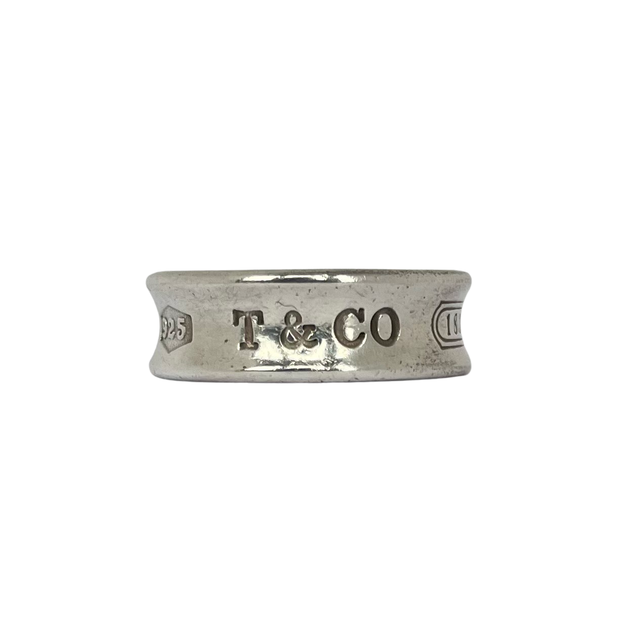 Tiffany 925 silver ring with 'T & CO 1837 925' engraving on a white background
