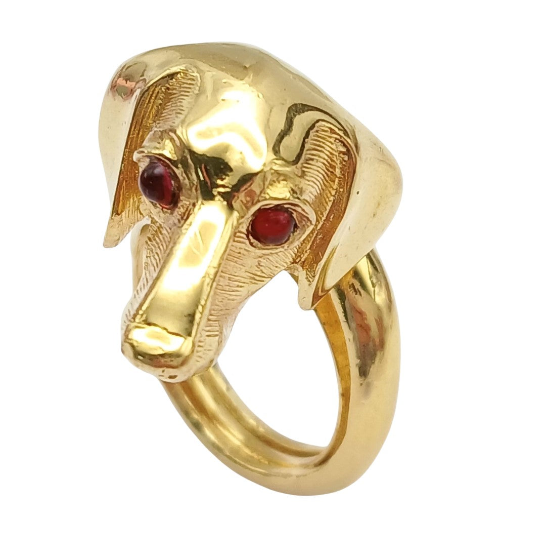 Vintage Crown Trifari Dachshund dog head ring in textured gold-tone Trifarium. This rare bypass style ring features a detailed dachshund face with vibrant red glass cabochon eyes and a wraparound textured band