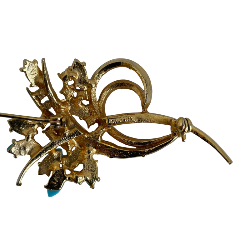 A Vintage Faux Turquoise Brooch signed Exquisite