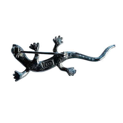 The reverse side of  vintage Butler & Wilson small lizard brooch showing early 1980s B & W backstamp in cartouche