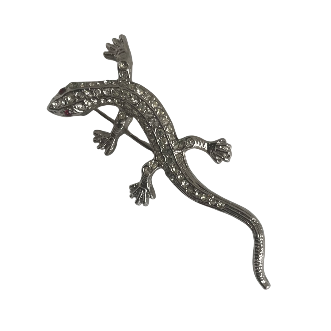 vintage 1980s Butler & Wilson small lizard brooch entirely pavé set with clear crystals and red crystal eyes shown on white background