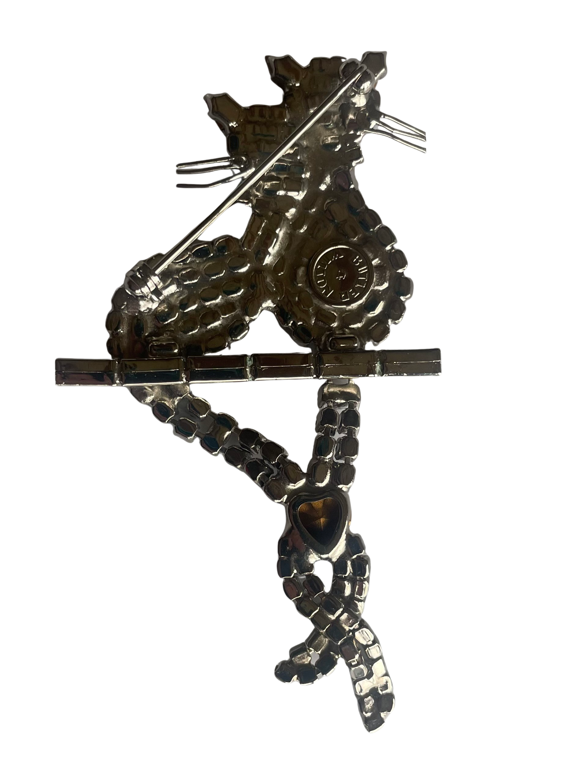 reverse side of Butler & Wilson vintage crystal cat brooch showing Butler &  Wilson backstamp in circular cartouche and fully functioning rollover clasp.