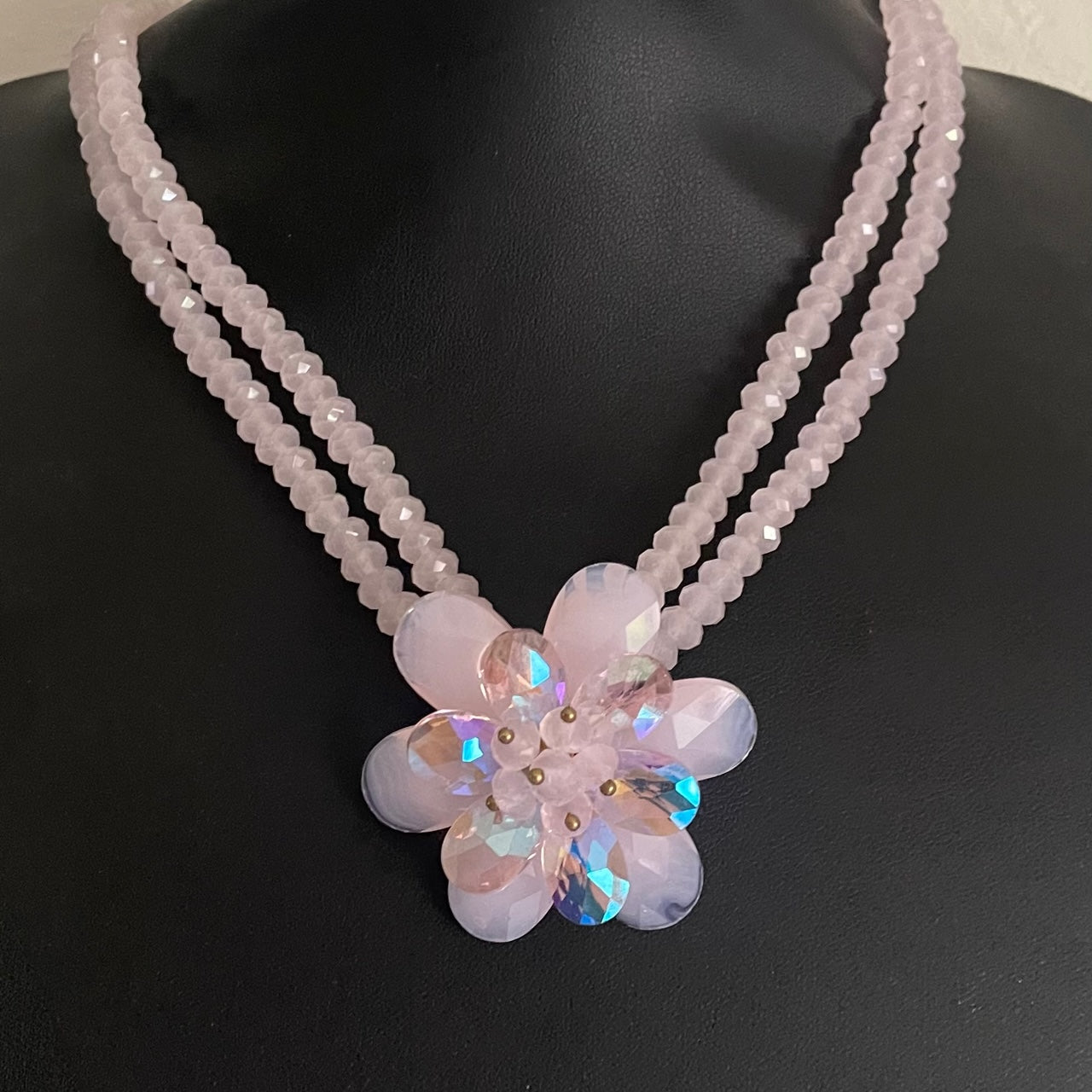 Vintage Butler & Wilson double-strand pink beaded statement necklace with an iridescent crystal flower pendant.