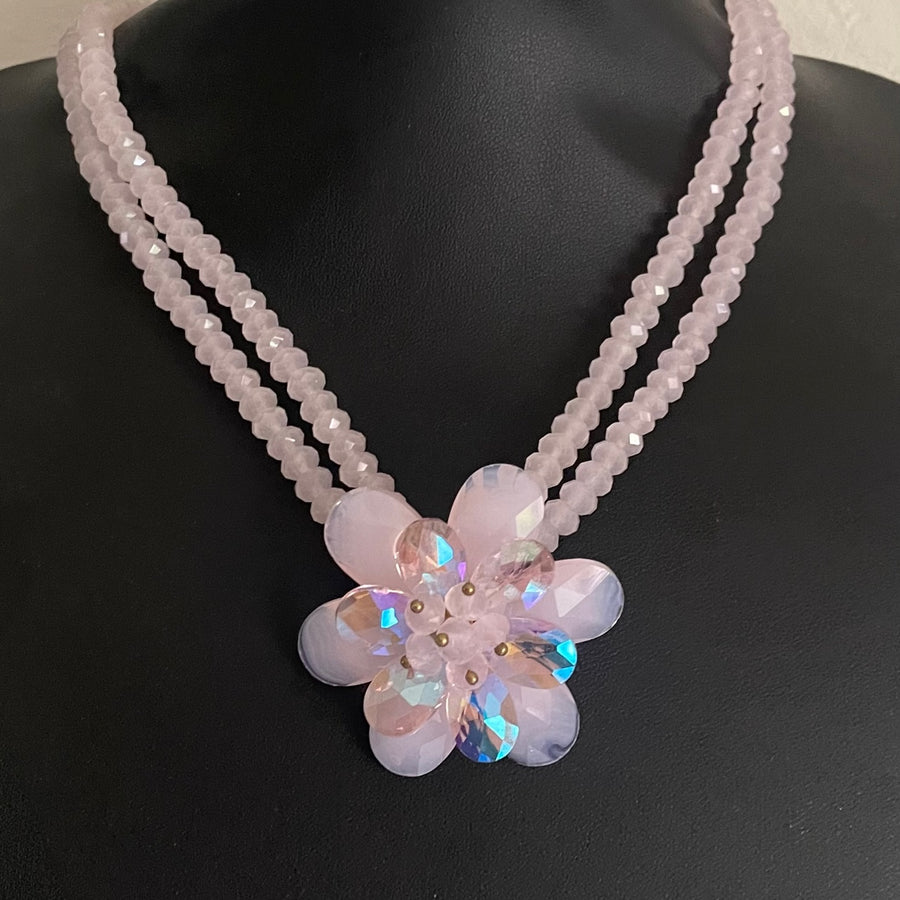 Vintage Butler & Wilson double-strand pink beaded statement necklace with an iridescent crystal flower pendant.