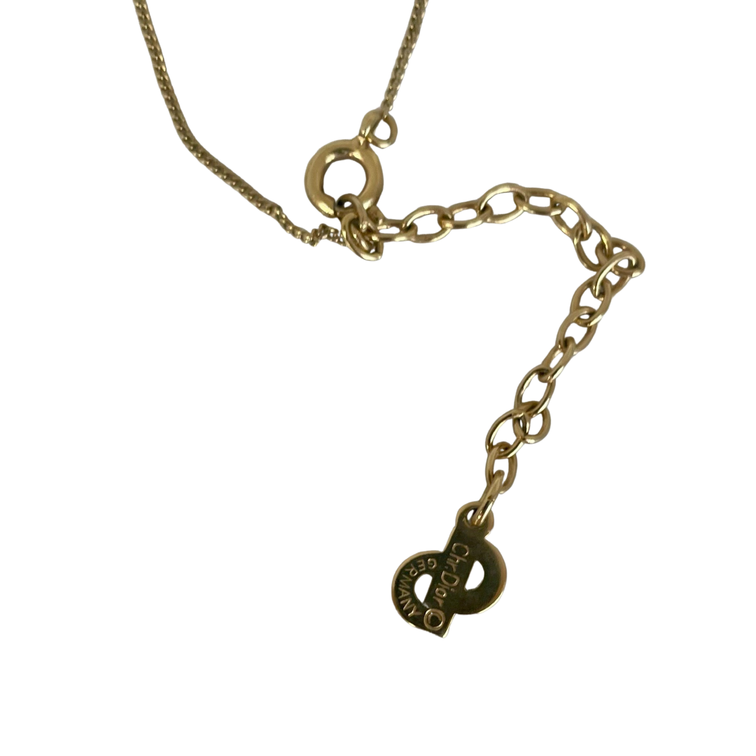 lobster clasp and extender chain signed Chr. Dior © Germany on vintage Christian Dior gold tone necklace with a tear drop faux pearl pendant topped with a sparkling Swarovski crystal.
