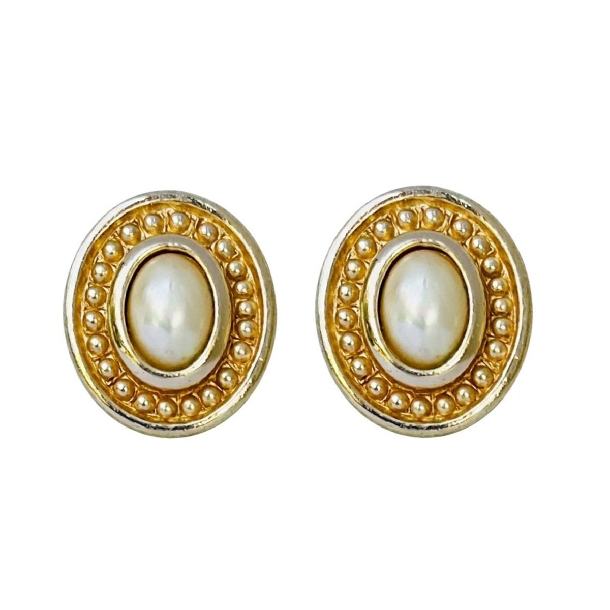 A pair of vintage 1980s Christian Dior gold-plated oval stud earrings featuring central white glass pearl cabochons framed by an intricate Etruscan-style beaded and polished border, shown against a plain white background.