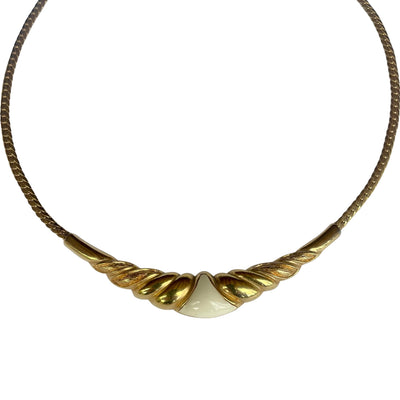 Vintage 1980s Christian Dior gold-plated collar necklace featuring a fluted centerpiece, cream enamel shield insert, and signed CD charm. Excellent condition