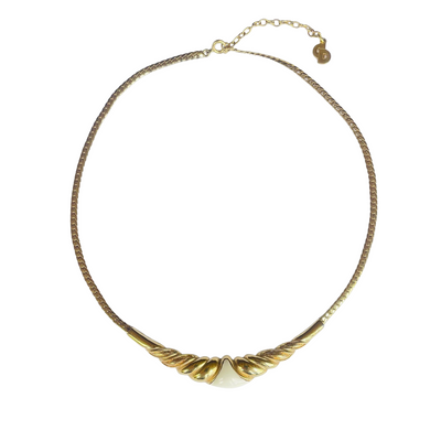 Vintage 1980s Christian Dior gold-plated collar necklace featuring a fluted centerpiece, cream enamel shield insert, and signed CD charm. Excellent condition.