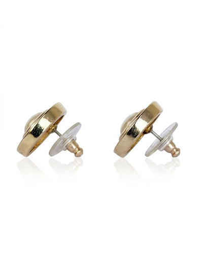 The side of a pair of vintage Christian Dior gold-plated earrings, showing the straight post backings for pierced ear and the silicone backs.