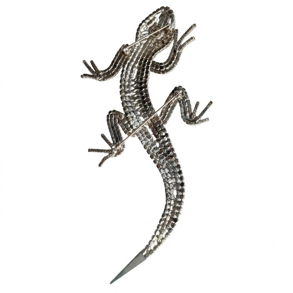 Reverse of magnificent 19 cm vintage Butler & Wilson silver-tone articulated lizard brooch showing the Butler & Wilson backstamp and two pin fastenings.