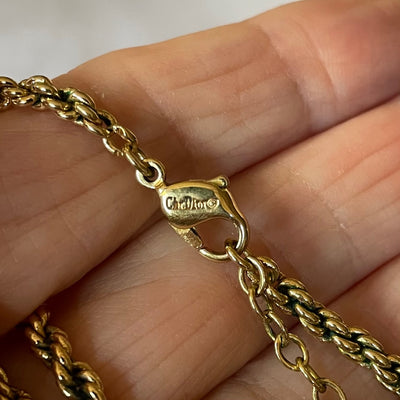 Close up of Christian Dior Ivy Leaf necklace showing Chr. Dior © stamp on lobster clasp.
