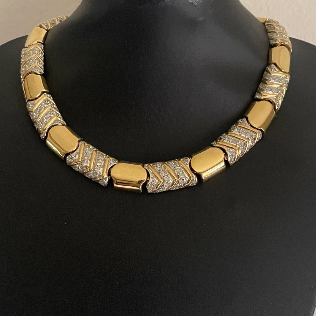 vintage Vogue Bijoux gold-tone collar necklace with pavé crystal chevrons displayed on a black mannequin bust.