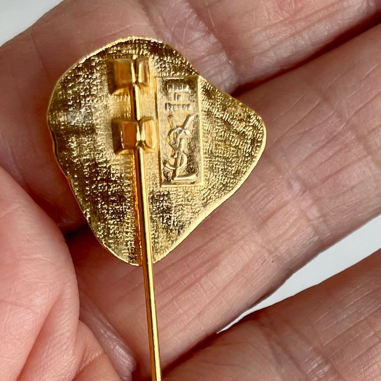 A Vintage Yves Saint Laurent Golden Nugget Stick Pin