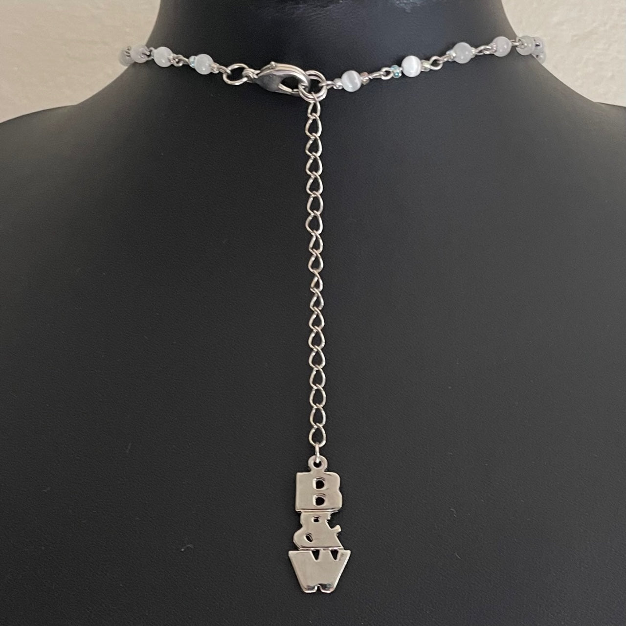 A Vintage Butler & Wilson Shades of White Flower and Heart Necklace