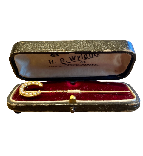 A late 19th Century Gold and Pearl Horseshoe Pin