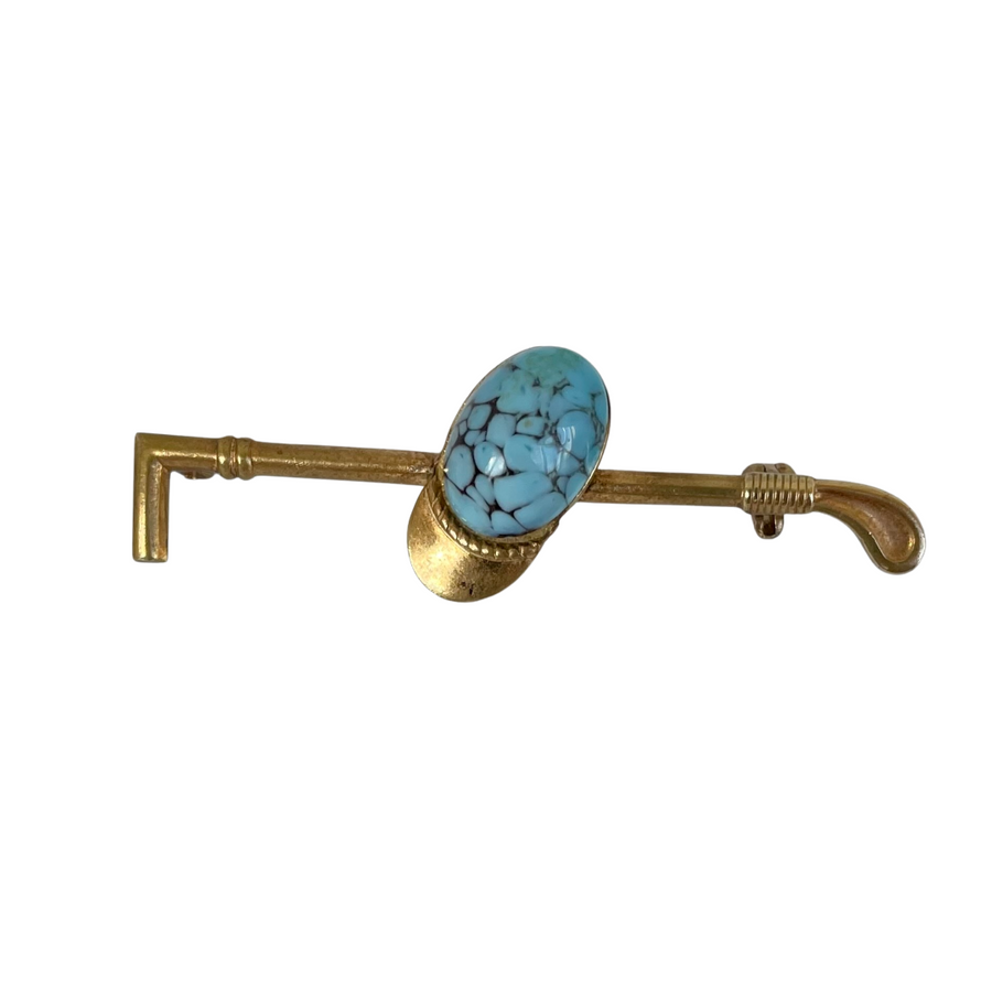 A Vintage Turquoise Riding Hat and Crop Stock Pin