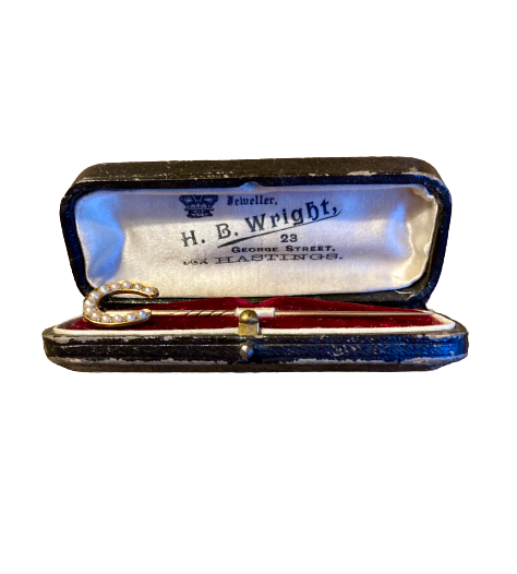 A late 19th Century Gold and Pearl Horseshoe Pin