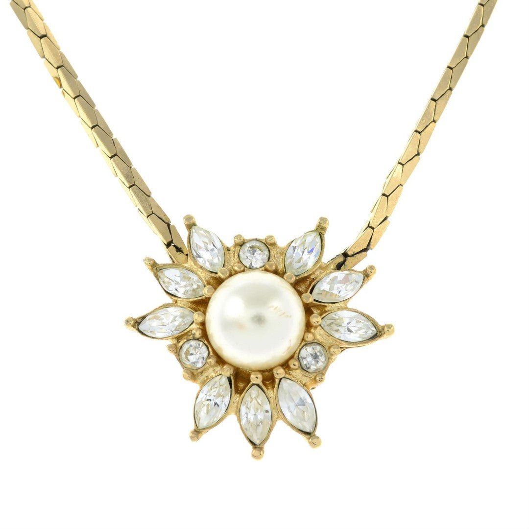 vintage Christian Dior sunburst pendant with central faux mabé pearl and alternating round and marquise crystals