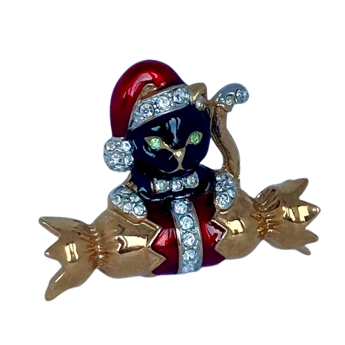 A Butler & Wilson Black Cat on Cracker Brooch