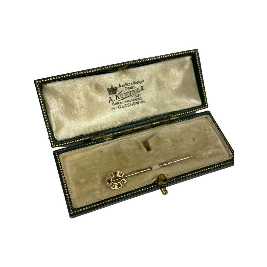 A Late 19th Century Horseshoe Stickpin, Ruby and Seed Pearl